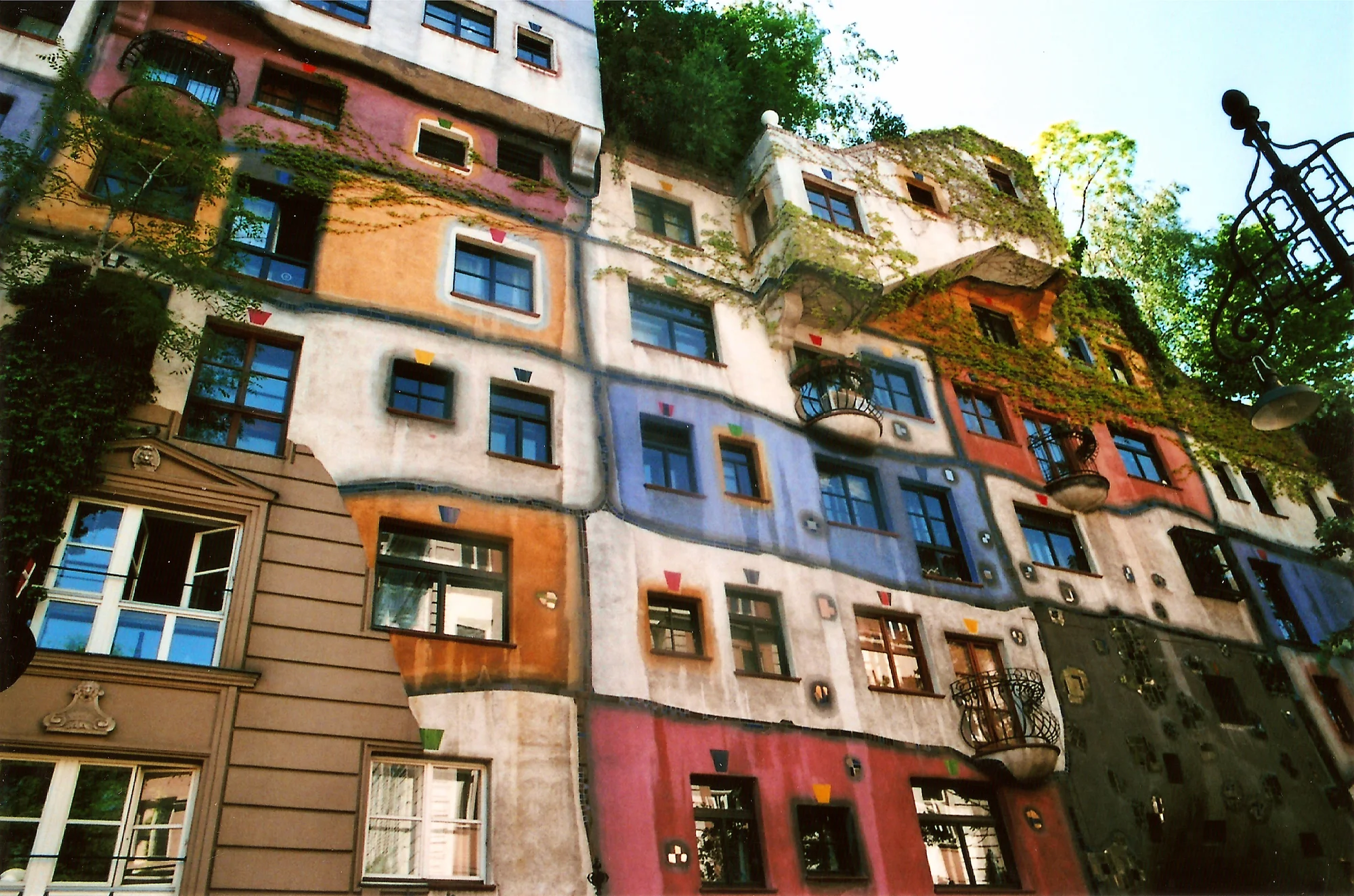 Photo of the Hundertwasserhaus building in Vienna with vibrant facades and unique artistic design.