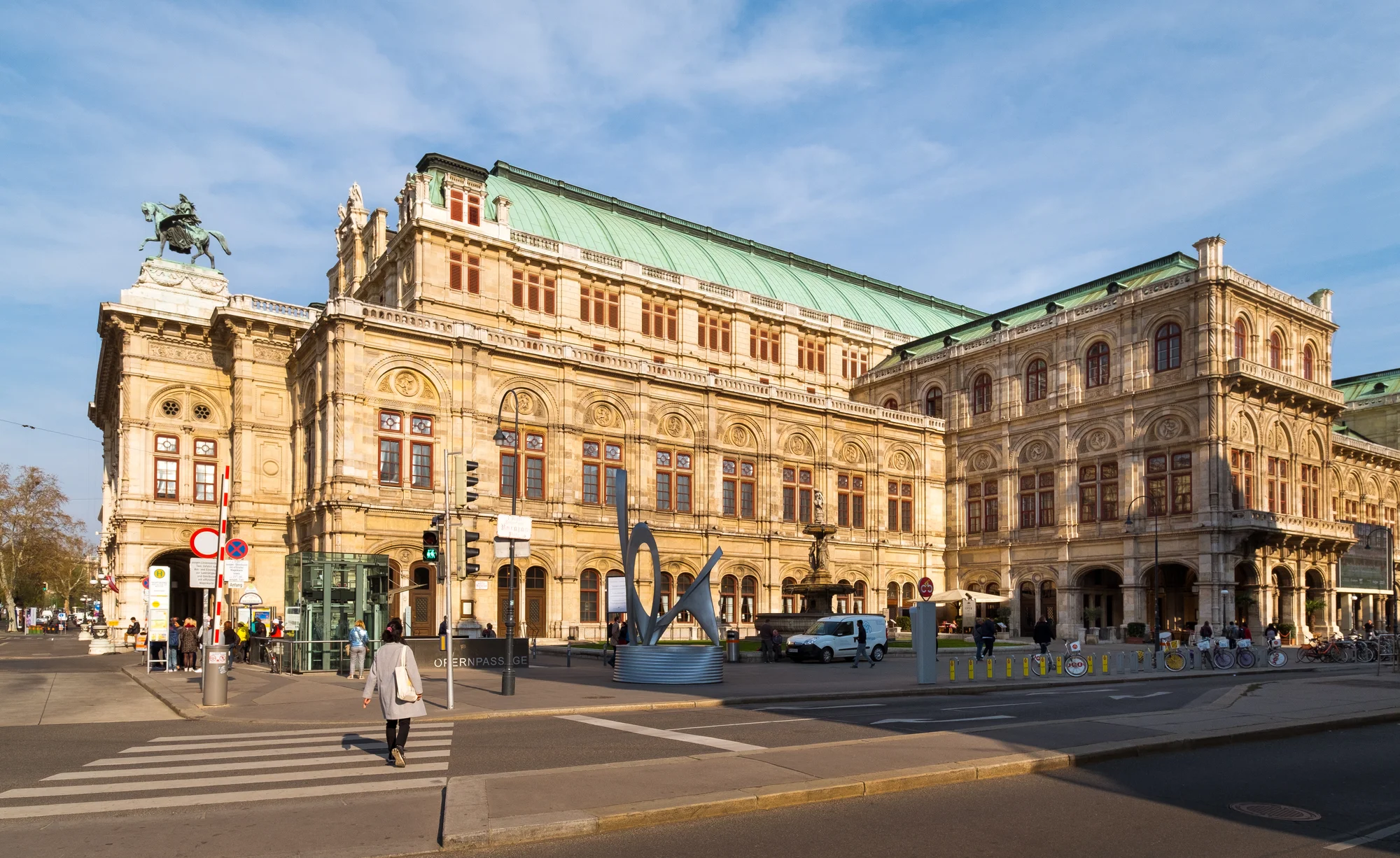 The Vienna State Opera building illuminated in sunlight, a cultural symbol of Vienna.