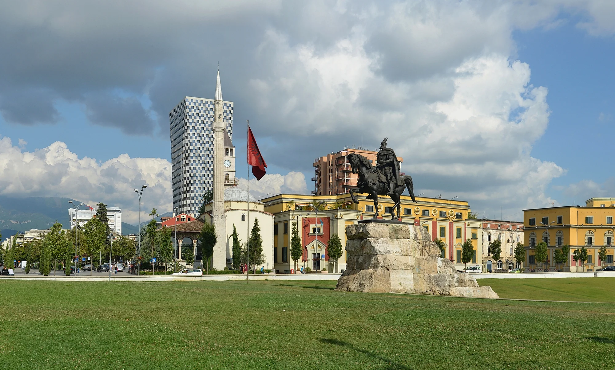 Skanderbeg Square in Tirana, with the Skanderbeg statue and historic buildings in the background.