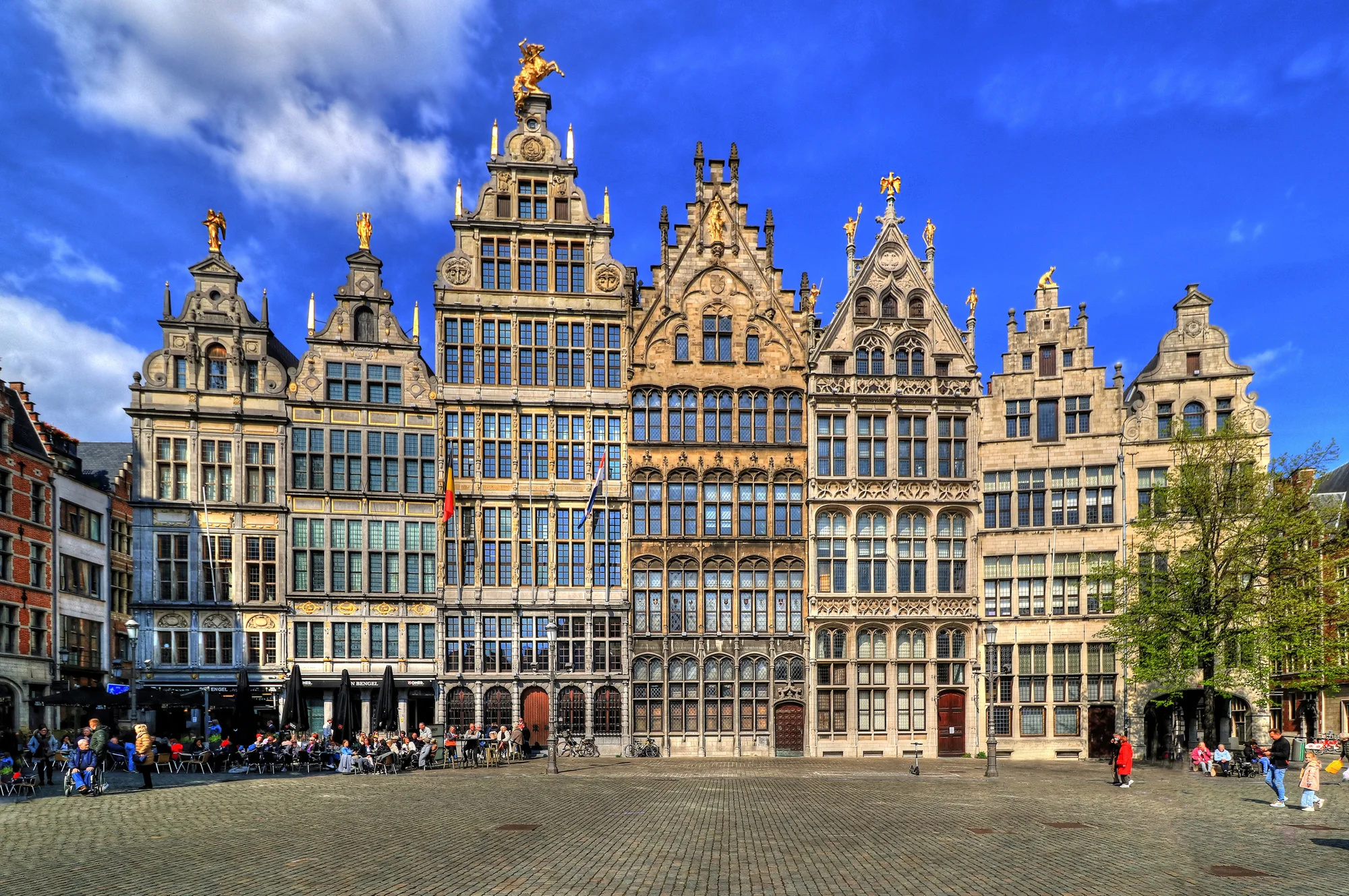 Historic buildings at Grote Markt, Antwerp, with styled facades and clear skies.