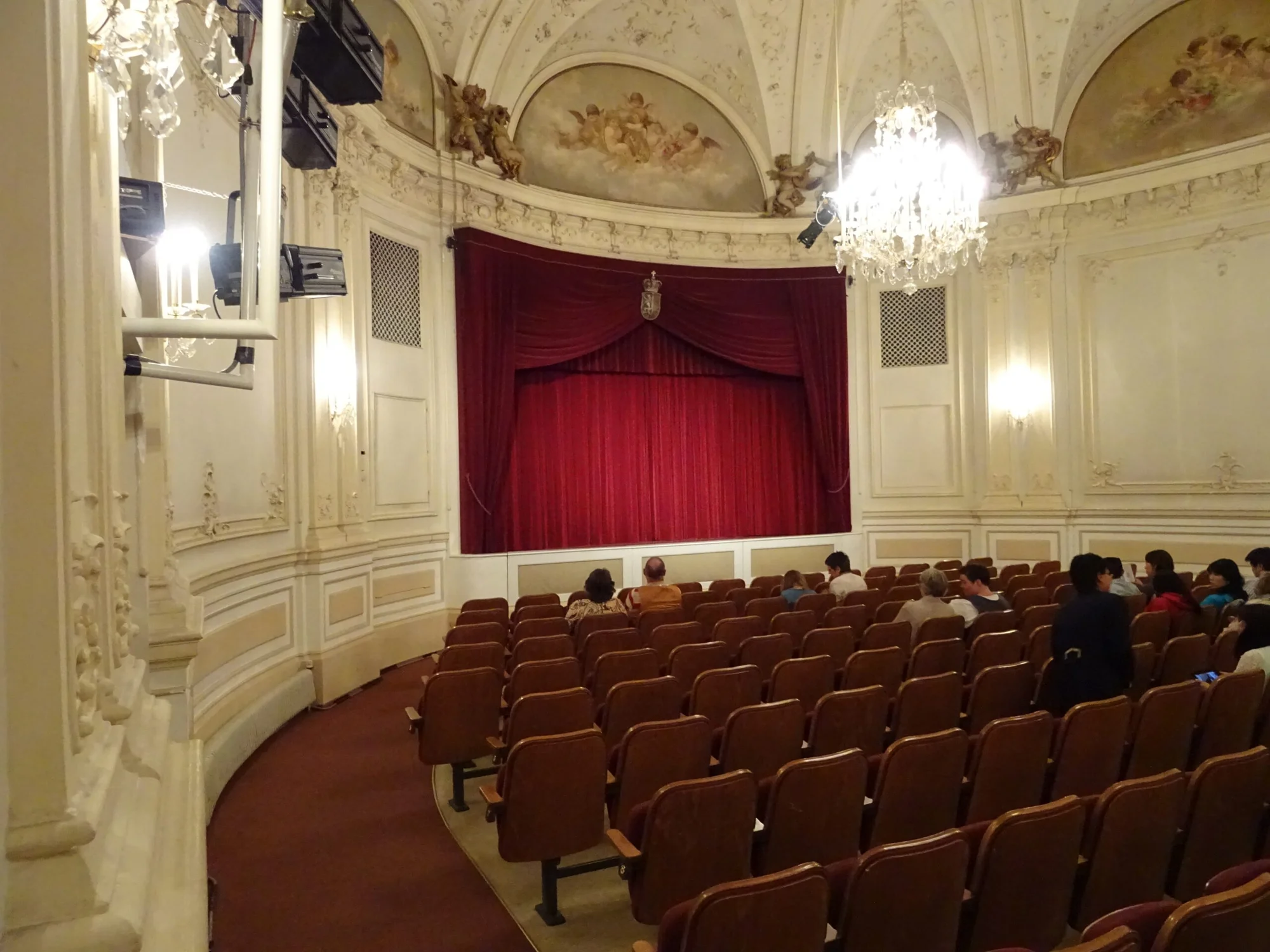 Interior of Salzburg Marionette Theatre, featuring impressive seating and stage for memorable performances.