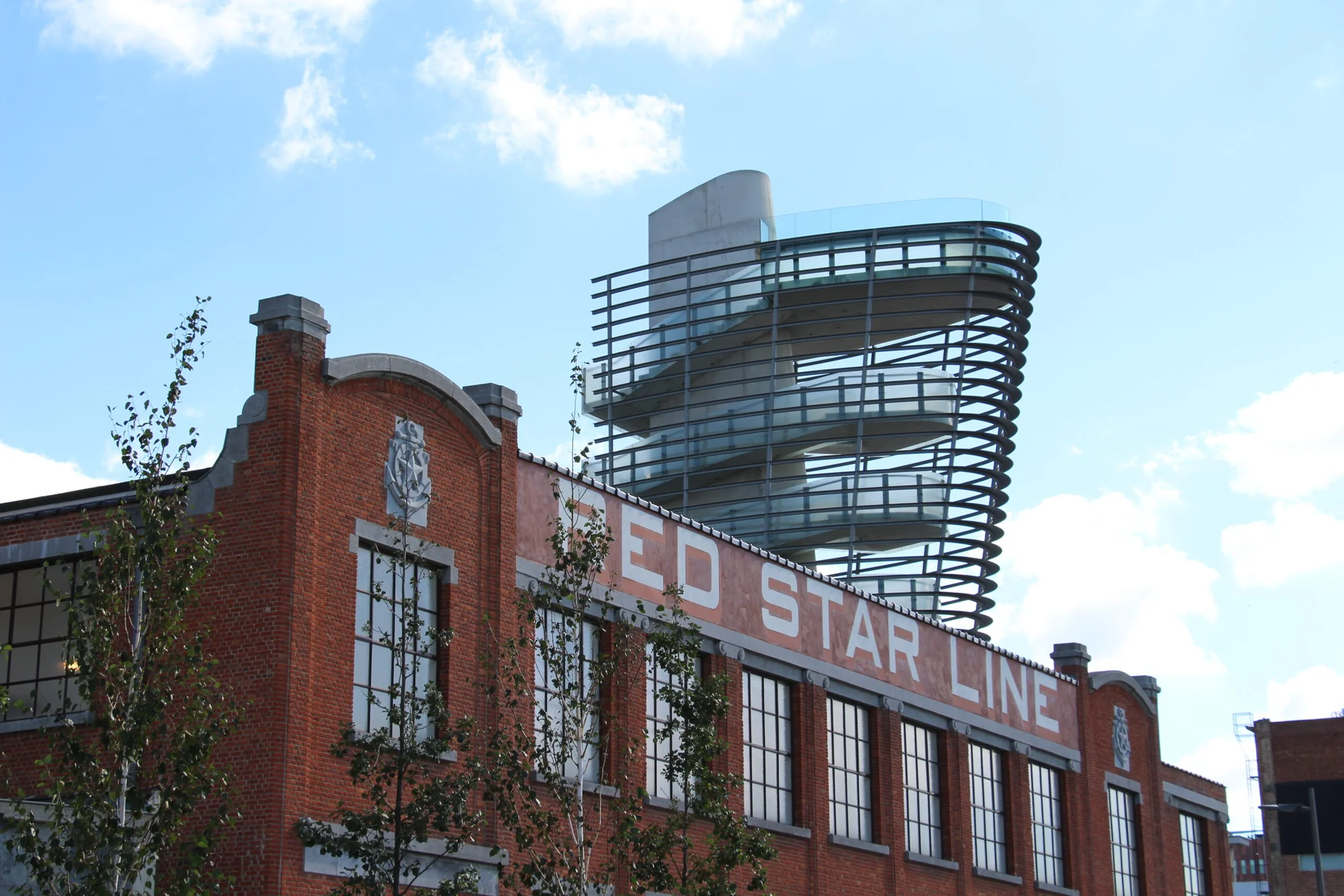 Façade of the Red Star Line Museum in Antwerp with iconic architecture and modern tower.