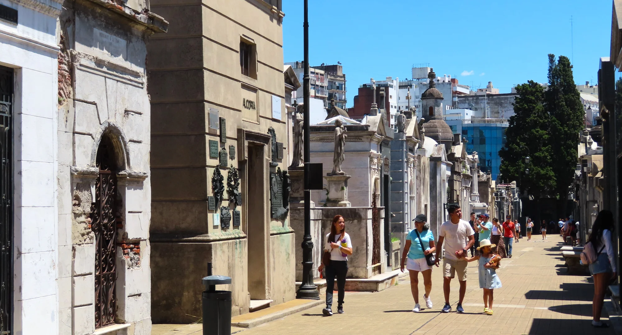 Paths of Recoleta Cemetery in Buenos Aires with decorated graves and impressive architecture.