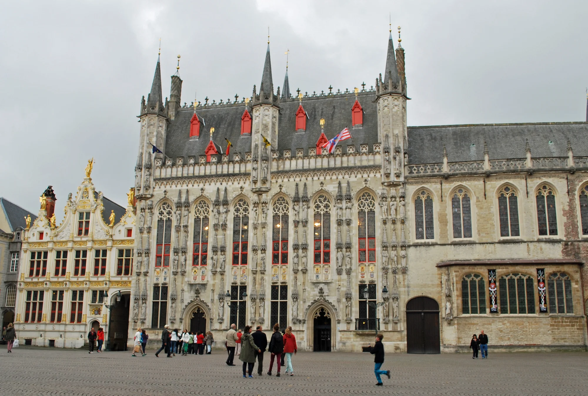 Gothic Town Hall in Burg Square, Bruges, with impressive architectural details.