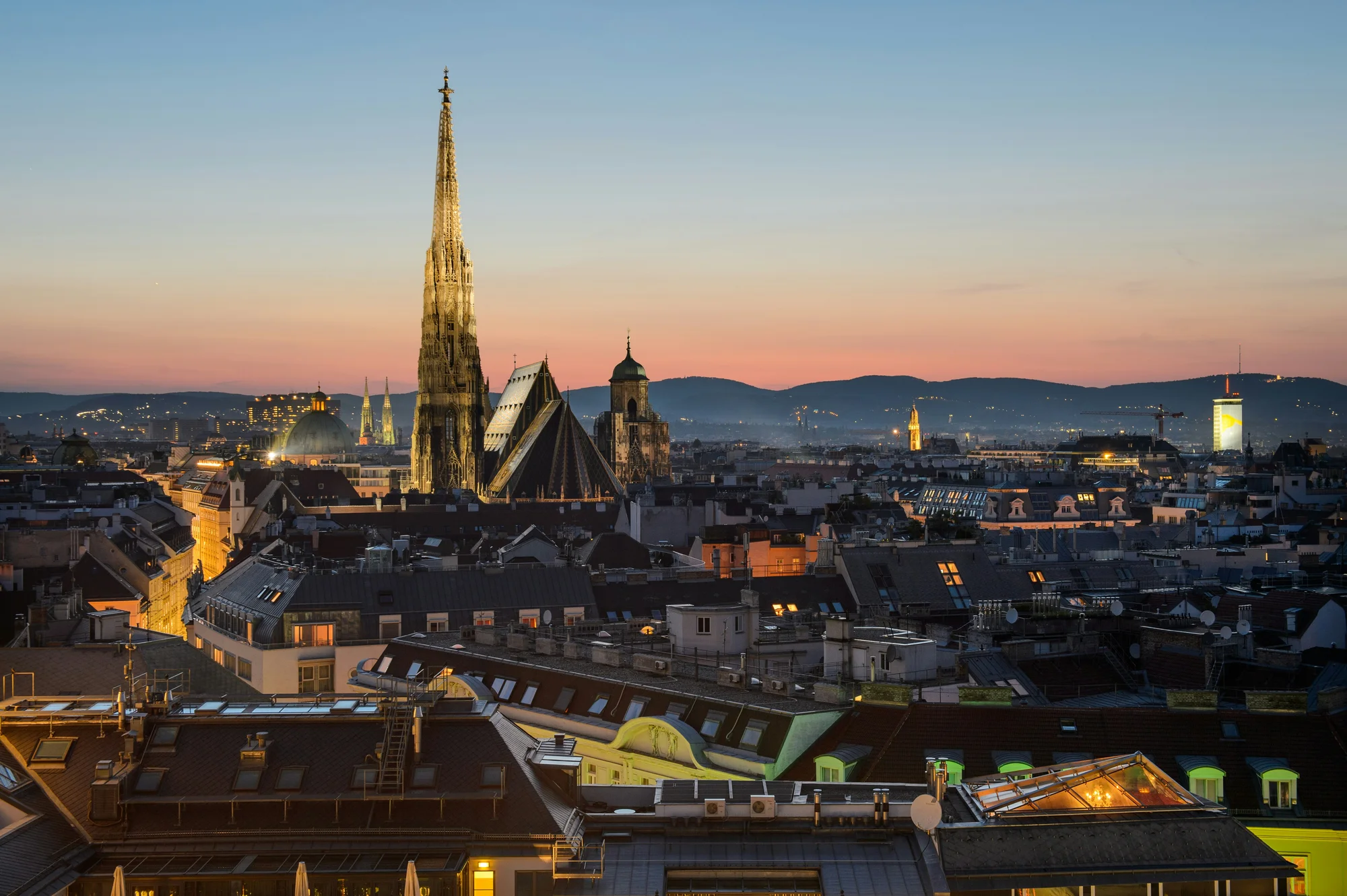 Sunset view of Vienna, highlighting St. Stephen's Cathedral and beautiful city architecture.