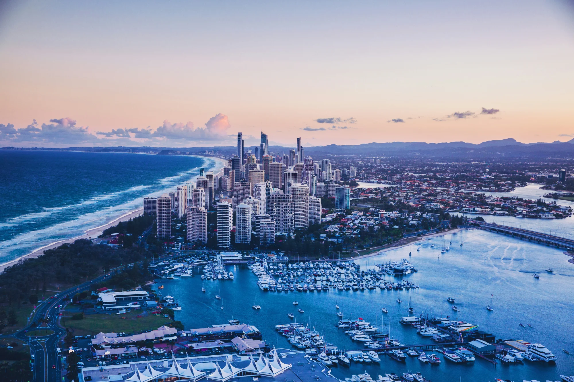 Aerial view of Gold Coast, Australia, with skyscrapers and the ocean.