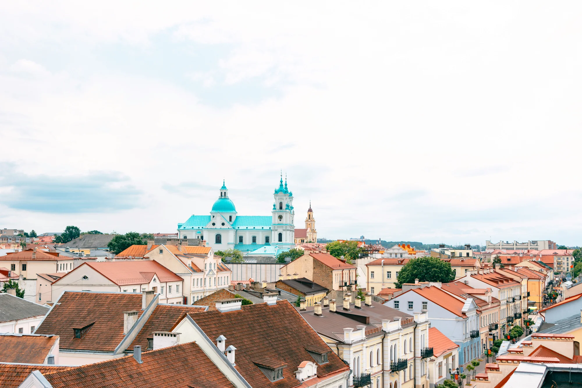 Panoramic view of Grodno city showcasing St. Francis Xavier Cathedral and local architecture.