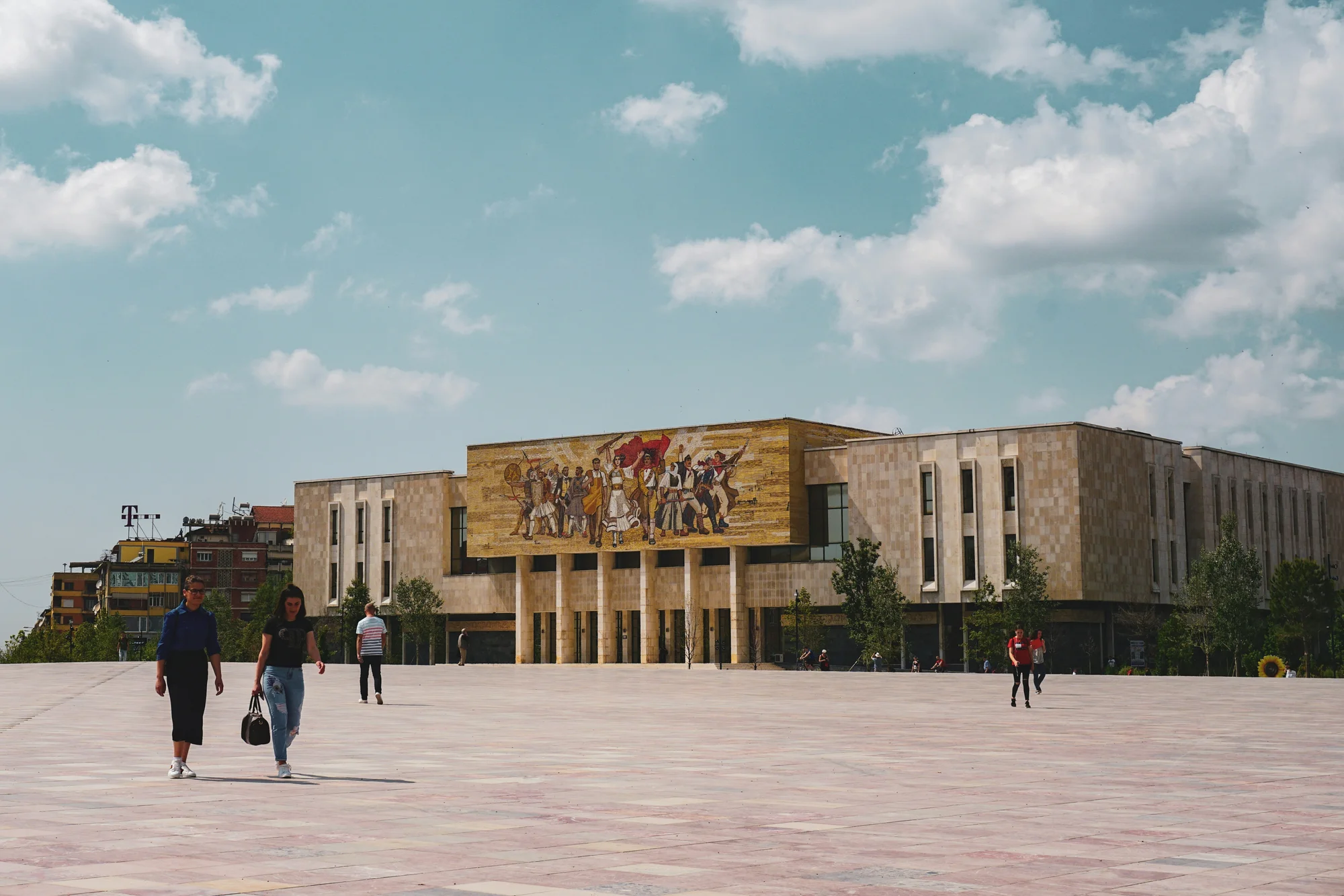The National History Museum in Tirana, Albania, under a clear blue sky.