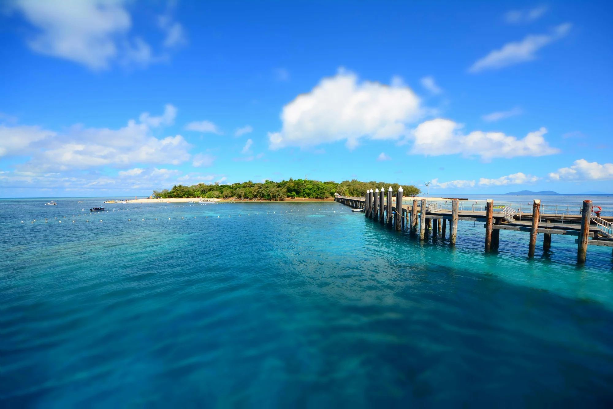 Green Island, view of pier and crystal-clear water, Cairns, Australia.