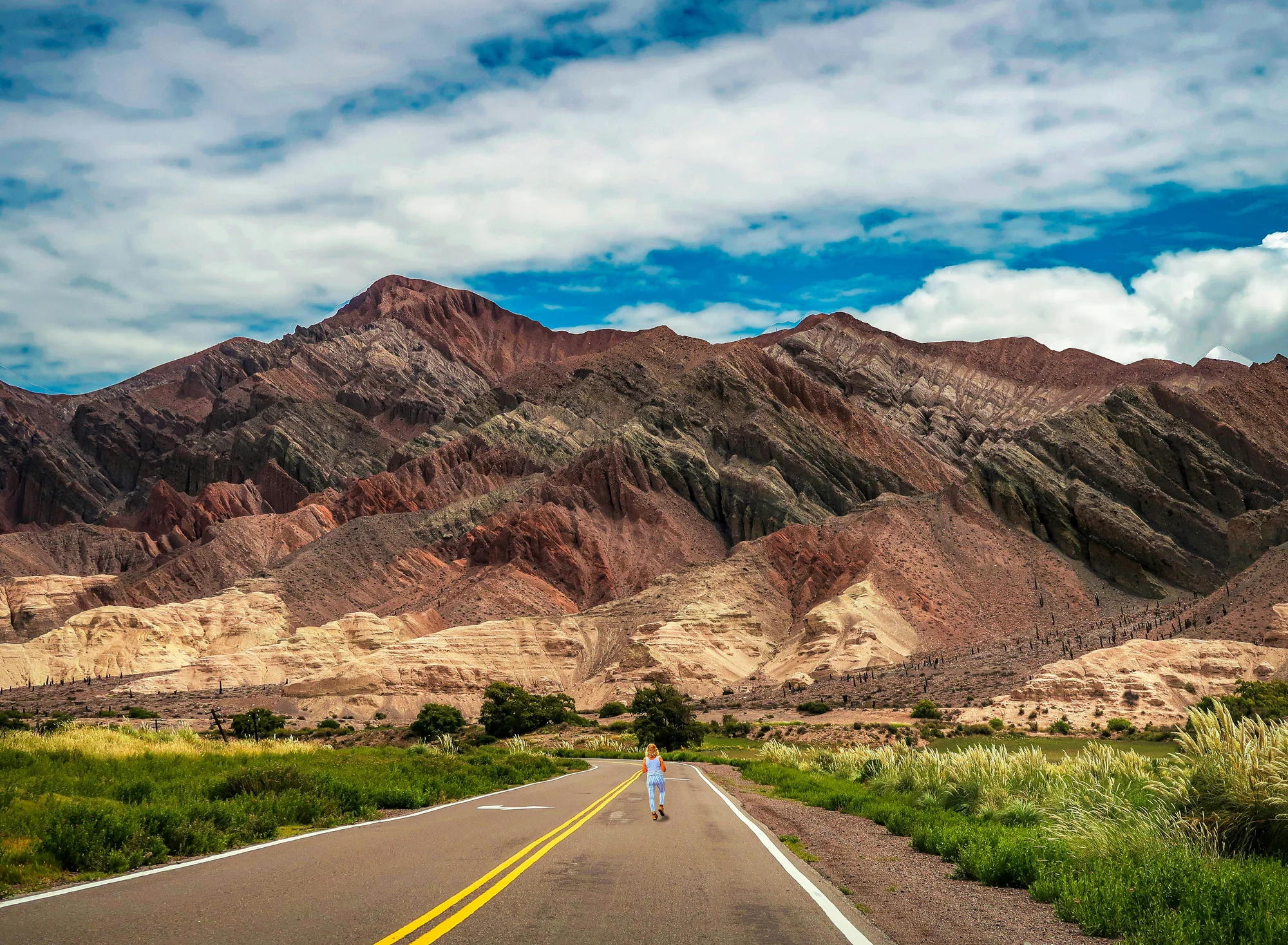 Colorful mountains and a winding road in Salta, Argentina.