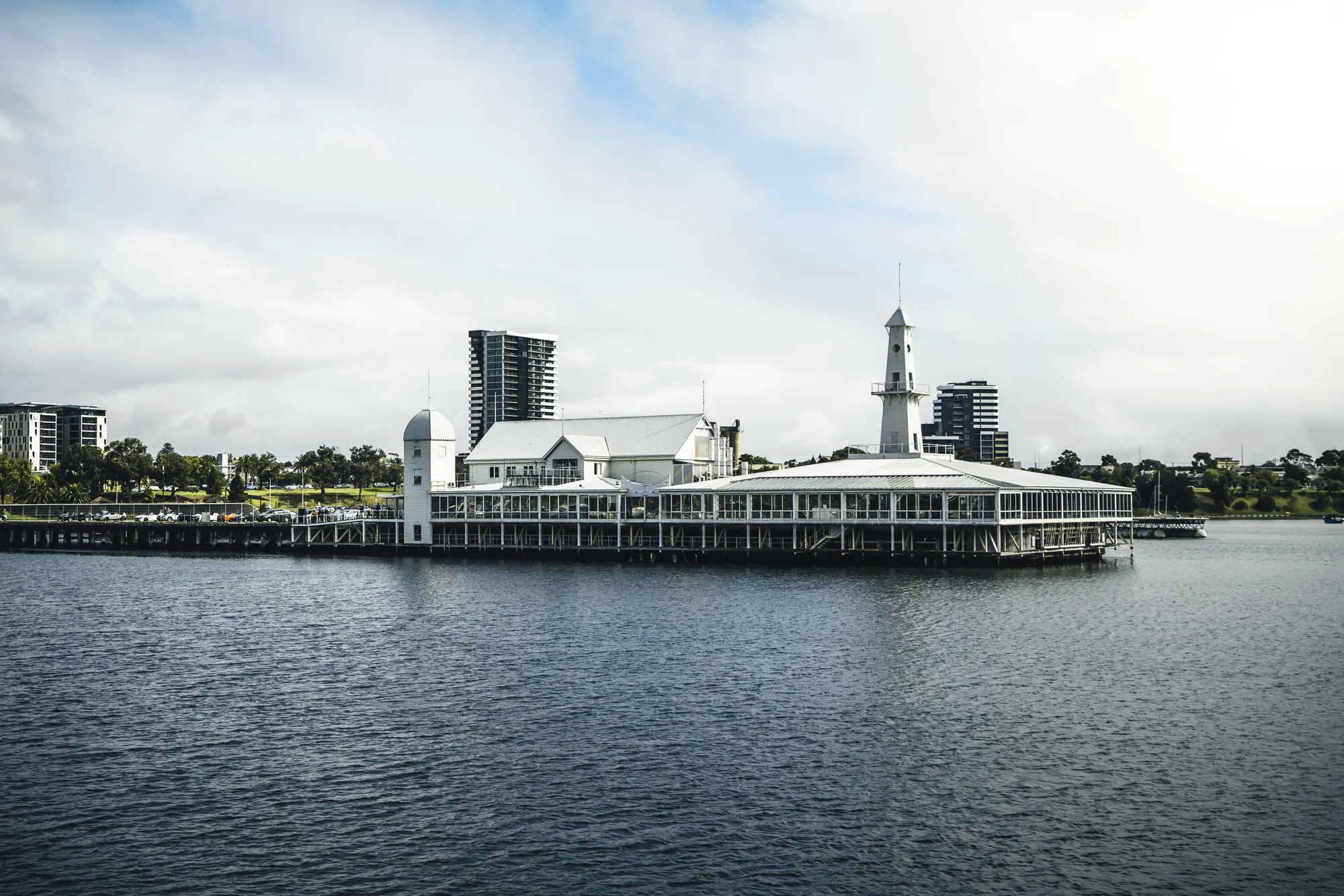 The historic waterfront of Geelong, featuring white buildings and a lighthouse.