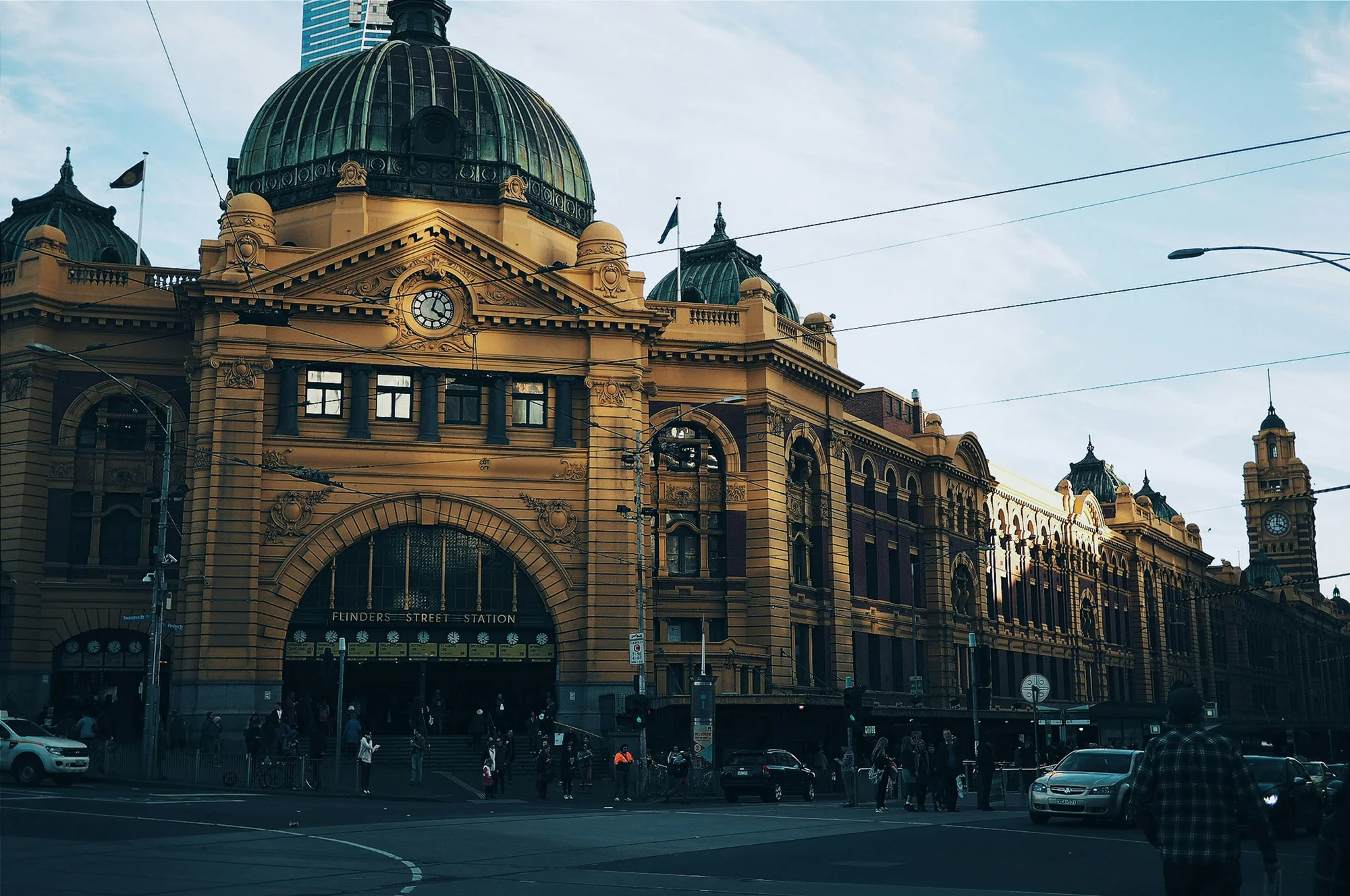 Flinders Street Station in Melbourne, an iconic building with a clock and distinctive architectural details.